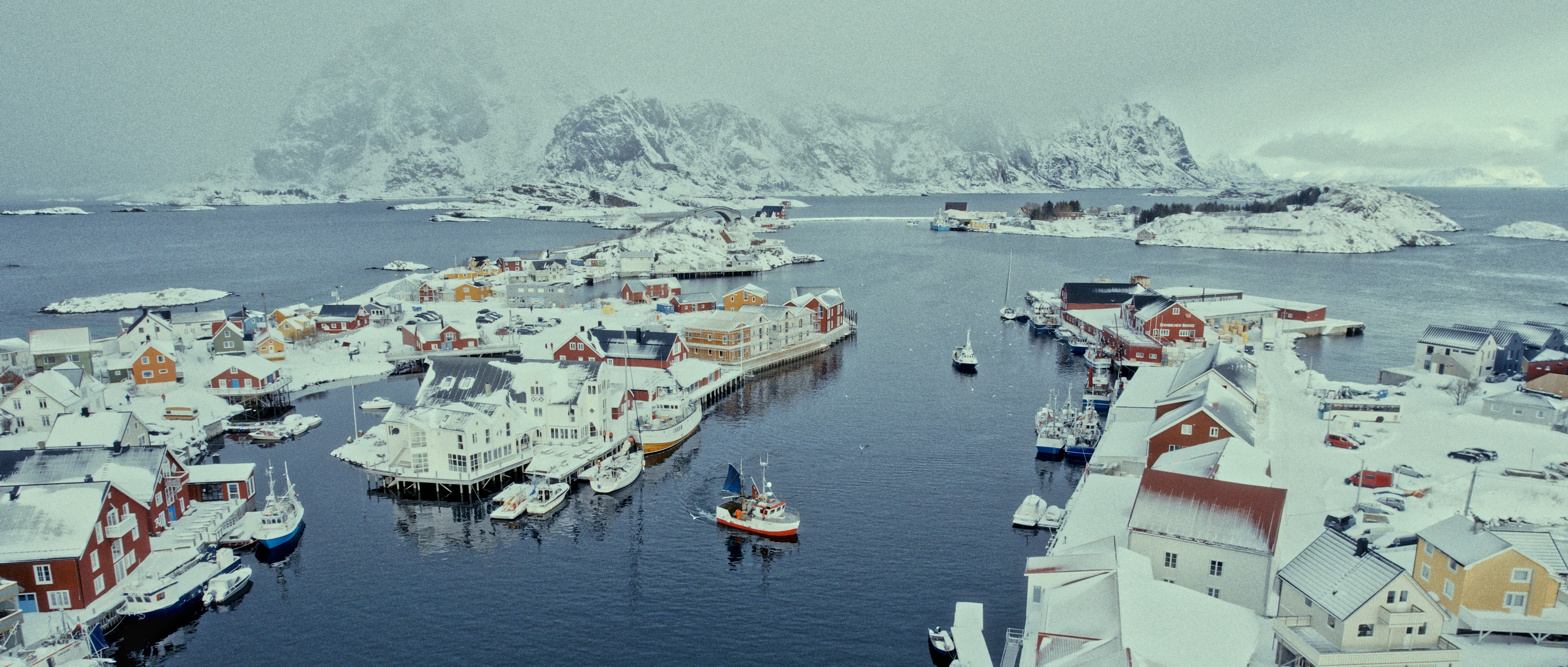 A fishing village surrounded by snow and sea in the Lofoten Islands
