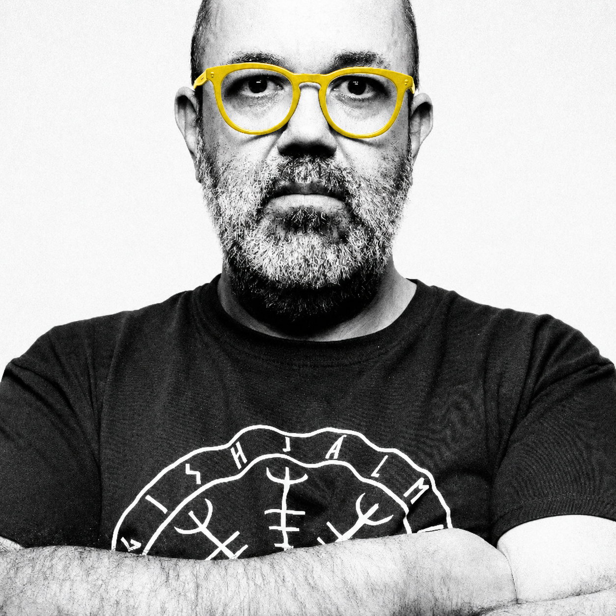 Portrait of director Miguel Cardoso wearing yellow glasses
